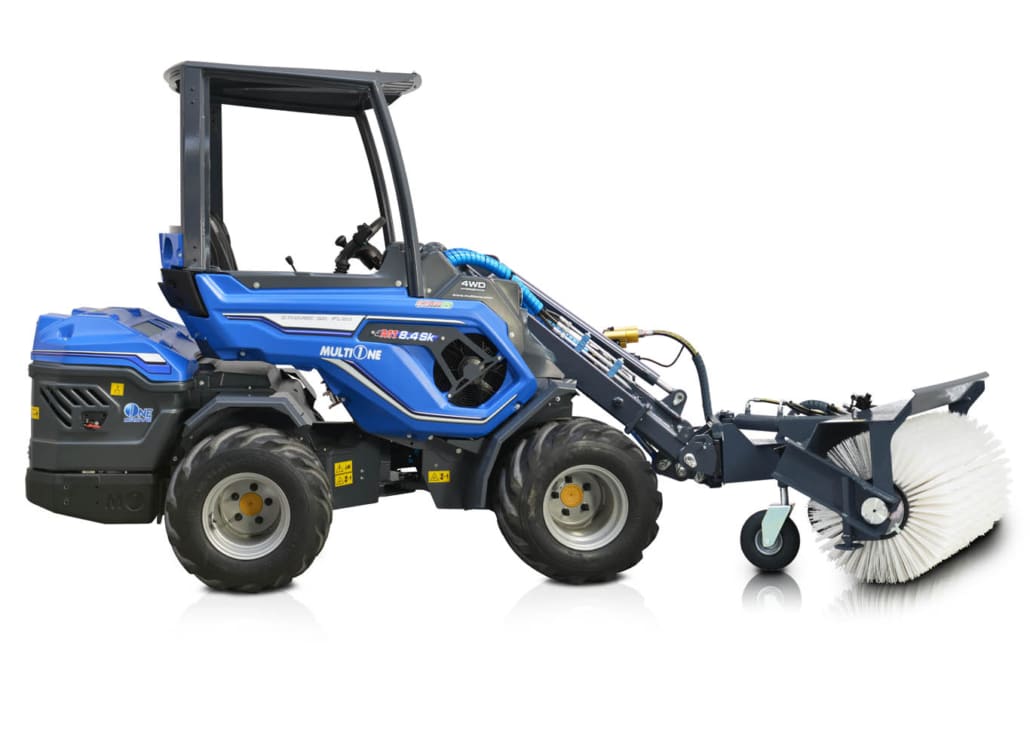 rotary sweeper assembled on a mini loader viewed from its right side