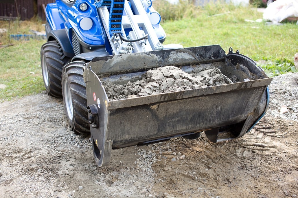detail of a concrete mixing bucket full of soil