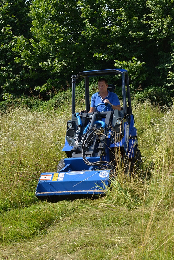 flail mower cutting grass from a front point of view