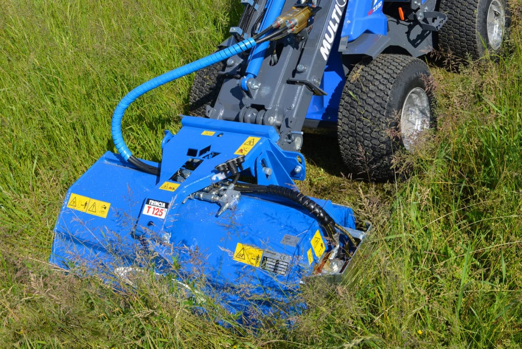 detail of a flail mower cutting grass