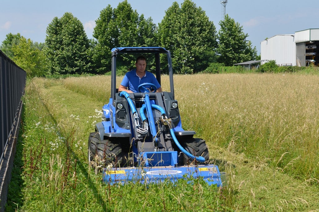 flail mower cutting grass seen from the front