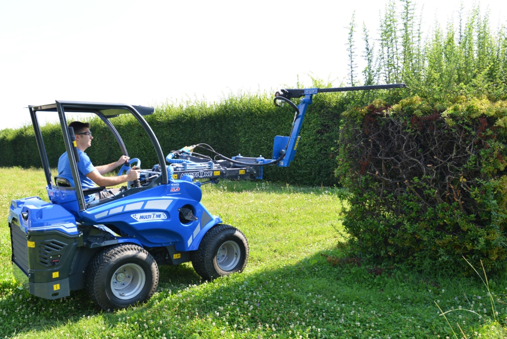 hedge trimmer trimming hedges