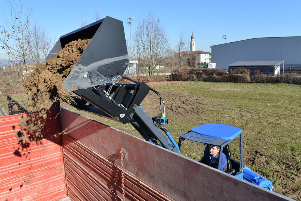 high tip bucket releasing soil