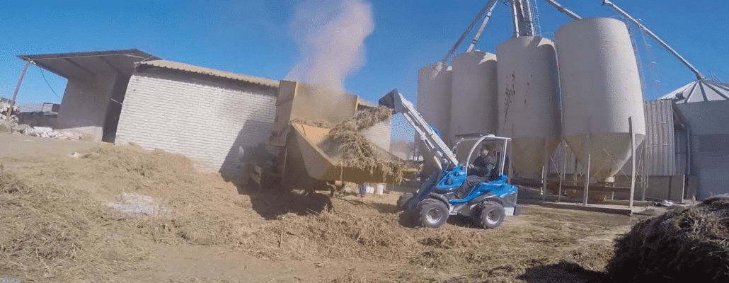 manure fork in action seen from afar
