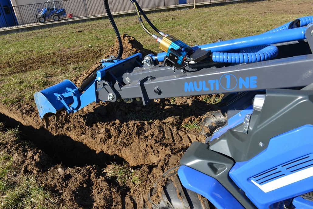 mini digger in action seen from the cabin point of view