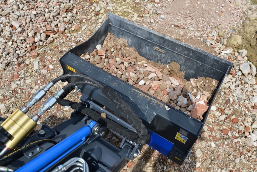 the inside of a screening bucket full of debris
