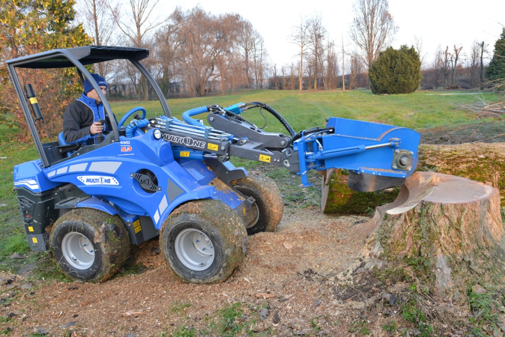 swing stump grinder in action full view