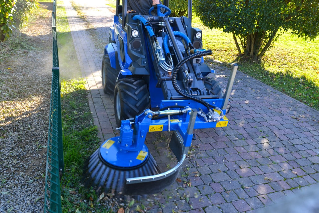 weed brush in action on a street
